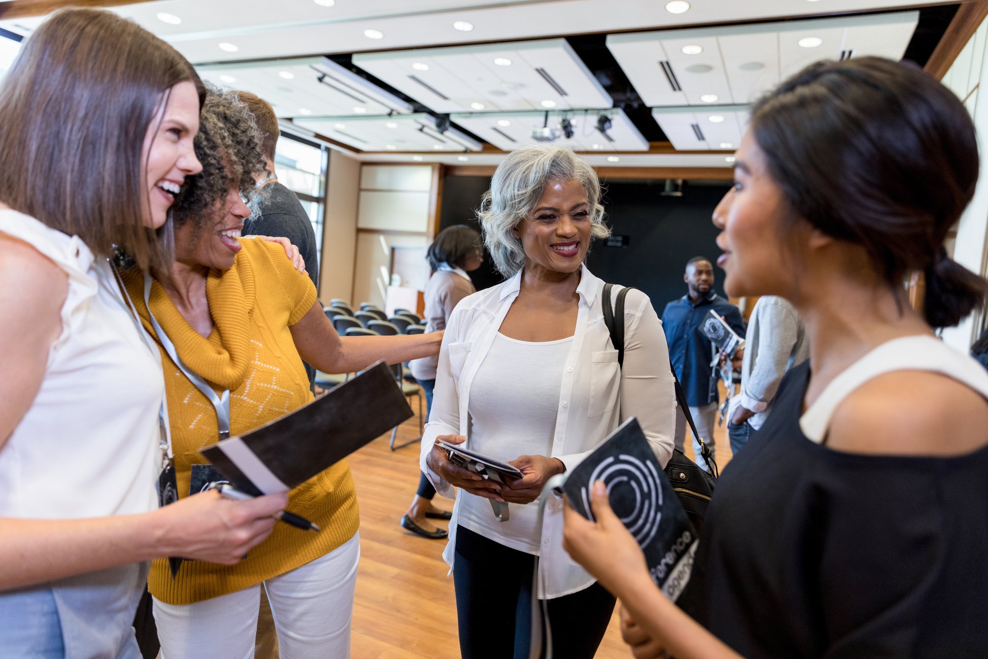 Women chat before women's event or conference